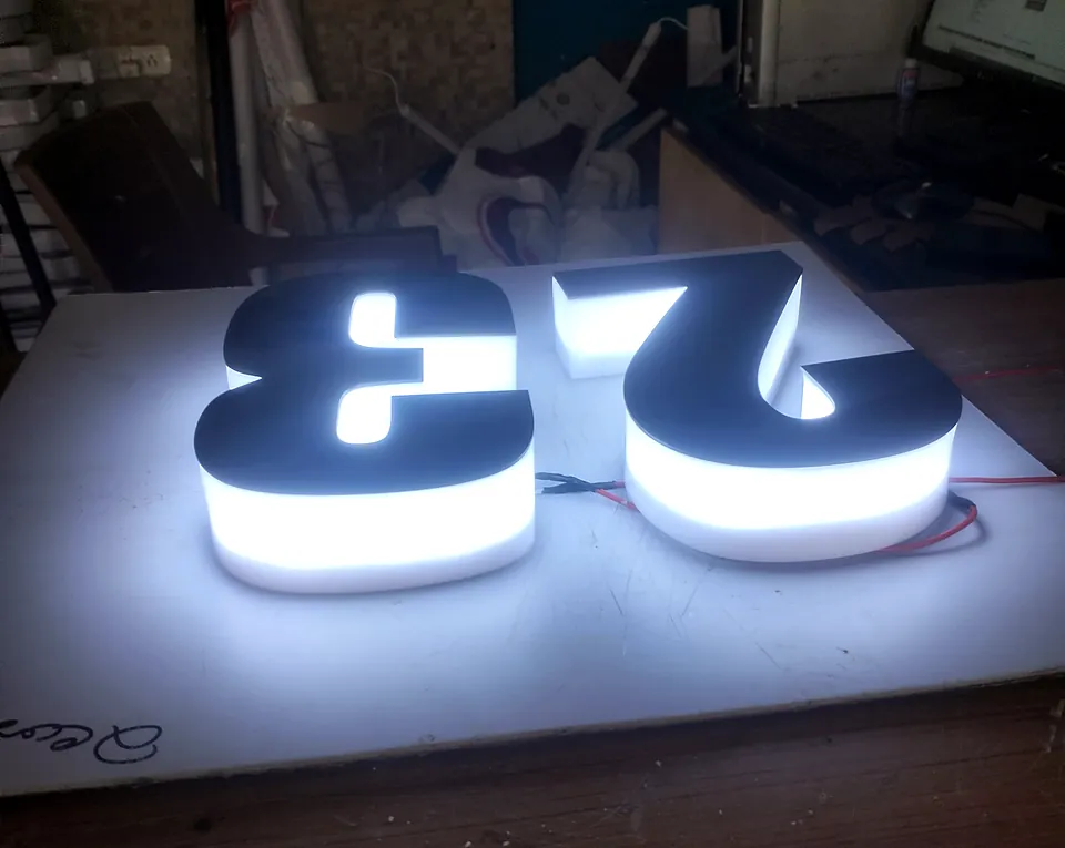 Back-lit 3D numerals glowing on a white test board